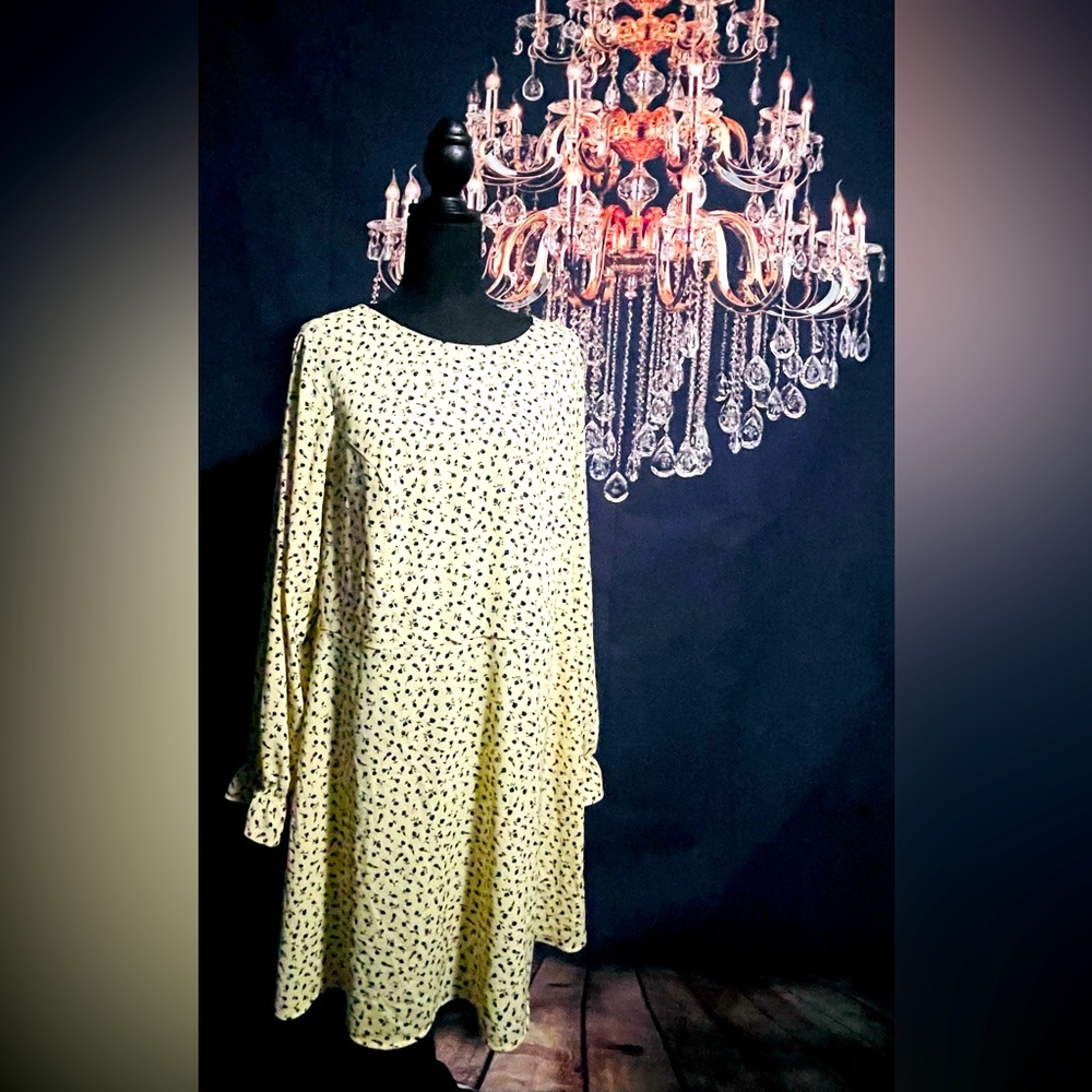 Pale yellow dress with black flowers